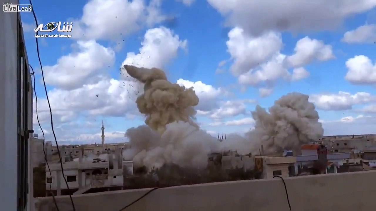 Close up footage of barrel bomb being dropped on Syrian city