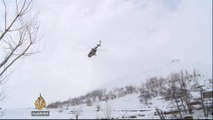 Afghan villagers bury their dead after avalanches