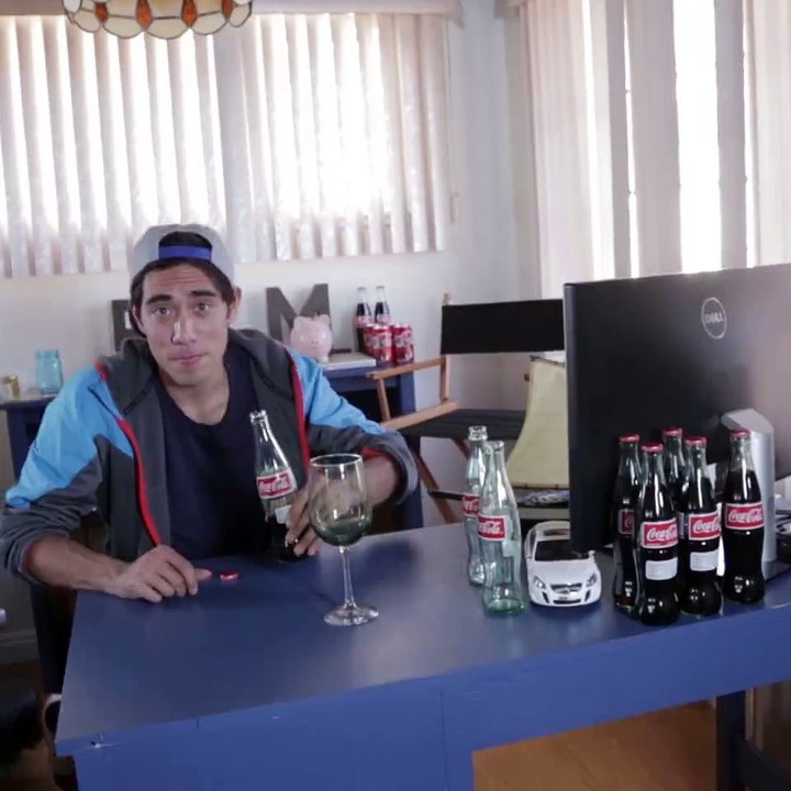 What happens with you blow into a coke bottle