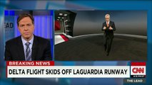 Why did Delta airplane skid off LaGuardia runway?