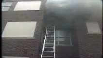 fire fighters taking peopleout from building