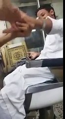 The Indian Barber Cutting Hair Of Arab Person