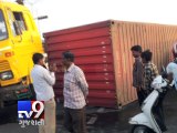 Container truck rolls over and flattens car, one injured - Tv9 Gujarati