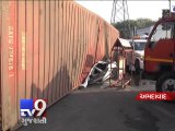 Container truck rolls over and flattens car, one injured - Tv9 Gujarati