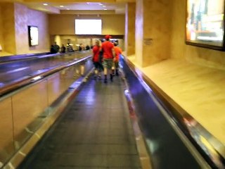 Using the moving walkway between the Excalibur and Luxor casinos in Las Vegas.