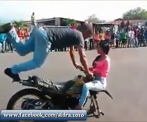 Stunt of boy With Girl And Bike