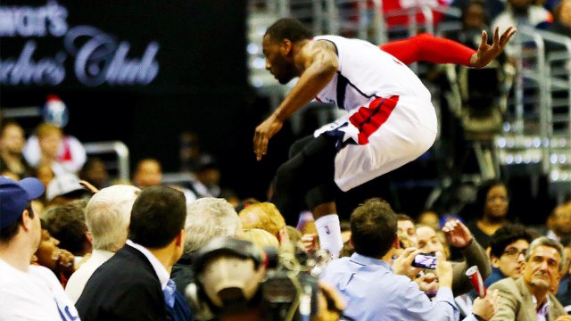 John Wall Dives into the Stands to Recover Loose Ball