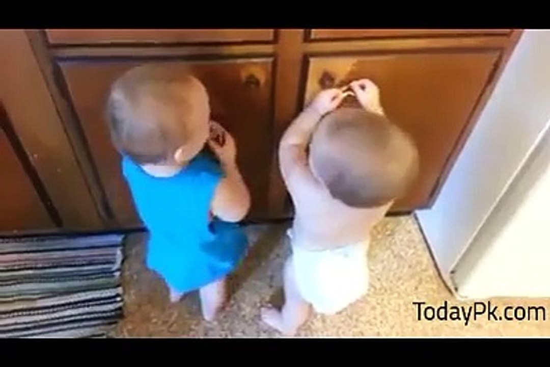Twin Cute Baby Playing With Rubber Band