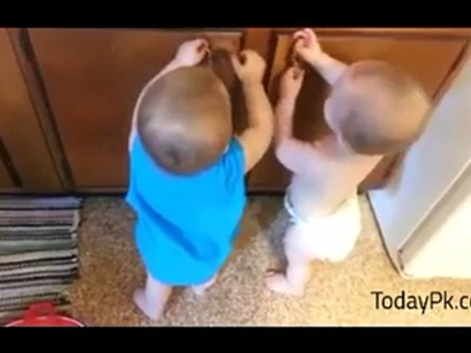 Twin Cute Baby Playing With Rubber Band