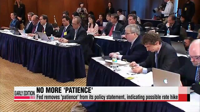 Fed opens door for rate hike but slashes growth, inflation outlook