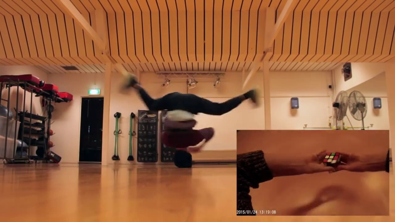 Break dance + Rubik's Cube : il tourne sur la tête et fini un rubik's cube en même temps