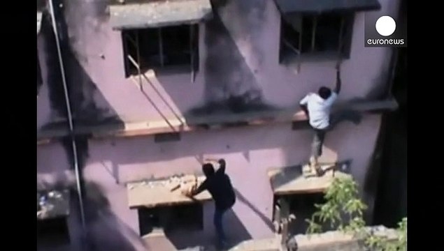 Reaching new heights: Parents in India scale walls to 'help students cheat'