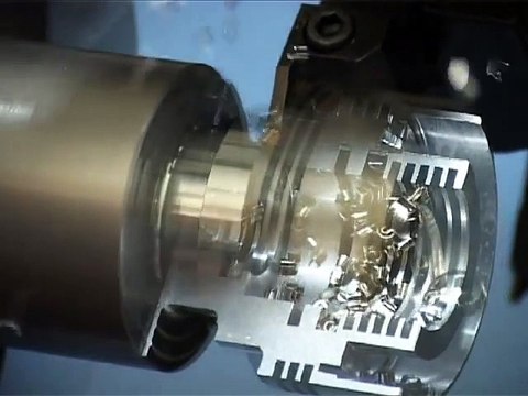 Time lapse view of internal boring, grooving and threading operation. Cut-Away photography.