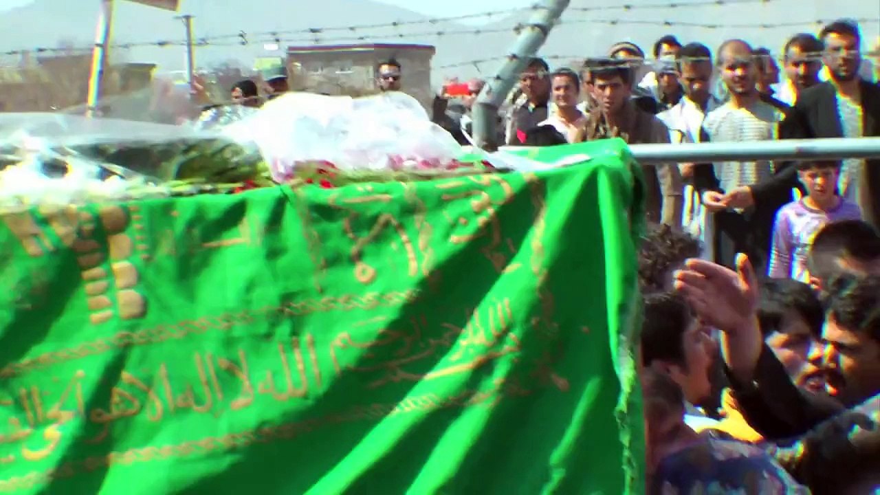 Hundreds of Afghans bury woman beaten to death by mob