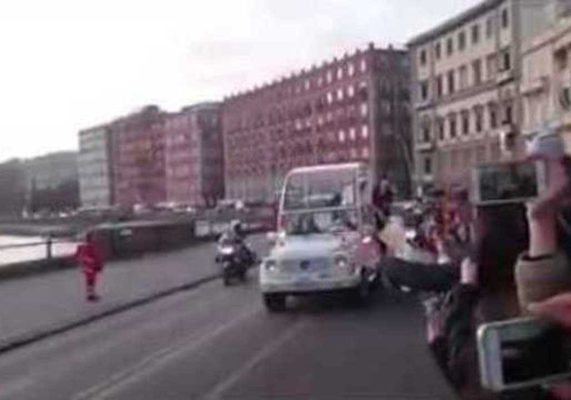 Pope Francis Accepts a Pizza on a Moving Popemobile