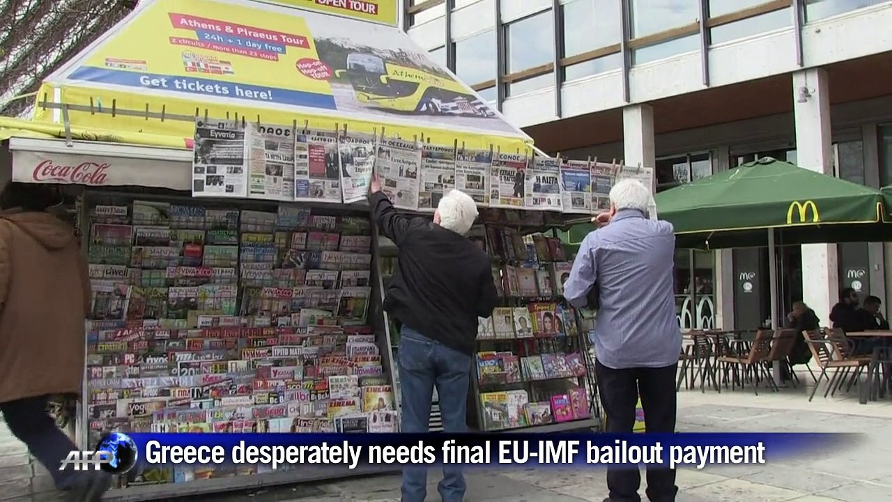 Greeks in Athens react to Greece-Germany debt t...