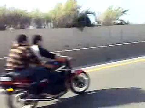 Brave Pakistani Girl doing one wheeling