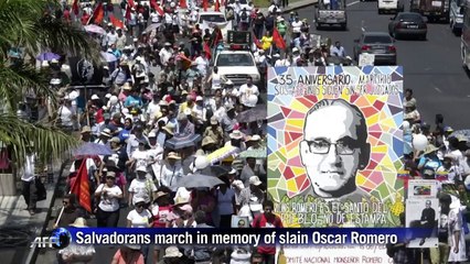Salvadorans march in memory of slain martyr Romero