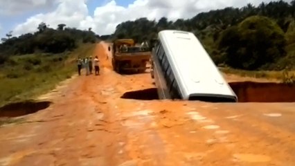Watch A Bus Get Swallowed By A Sinkhole & Swept Away
