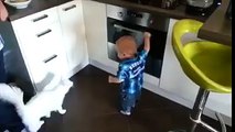 Cat stops baby from opening oven