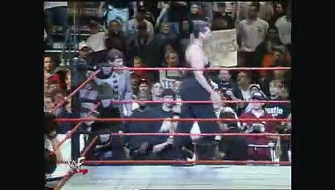 Stone Cold Steve Austin battles Mr. McMahon with one arm tied behind his back