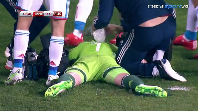 Montenegro v Russia suspended after Russia goalkeeper Igor Akinfeev hit by flare