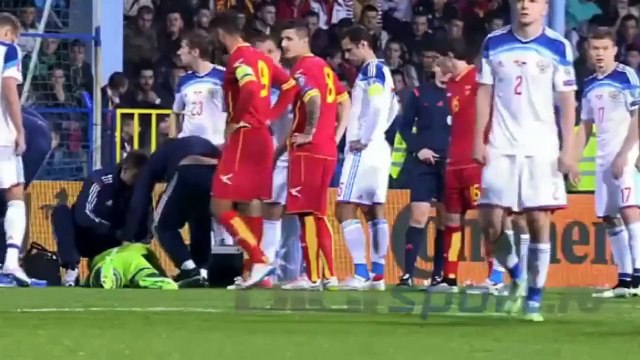 Montenegro v Russia suspended after Russia goalkeeper Igor Akinfeev hit by flare