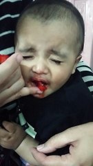 Cute baby reaction after sour strawberry ....
