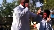 Pakistani School Teacher Beating his Students 2015 video