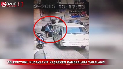 Televizyonu kucaklayıp kaçarken kameralara yakalandı