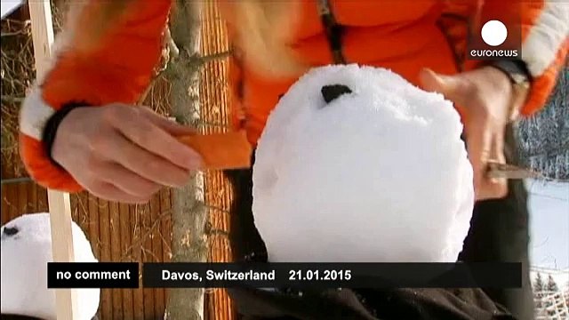 Snowmen greet participants at the World Economic Forum in Davos - no comment