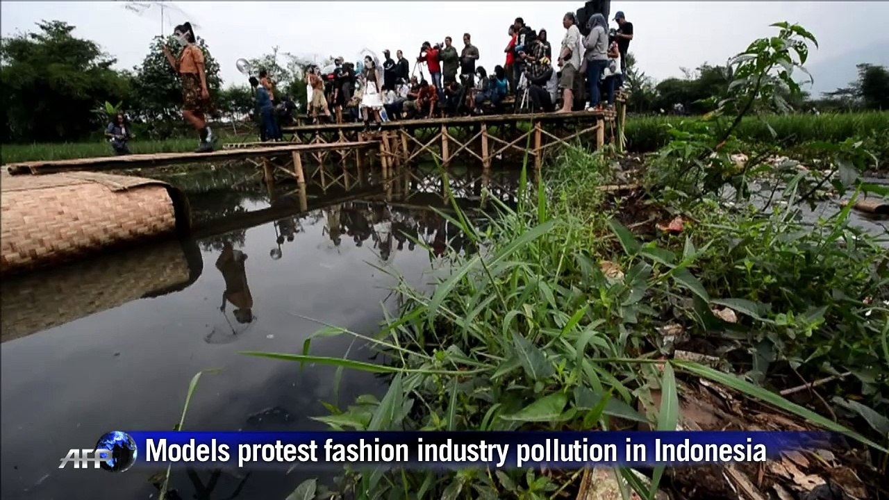 Models in masks highlight Indonesian environmental devastation