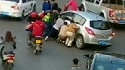 Woman Trapped Under Car Saved By Passersby