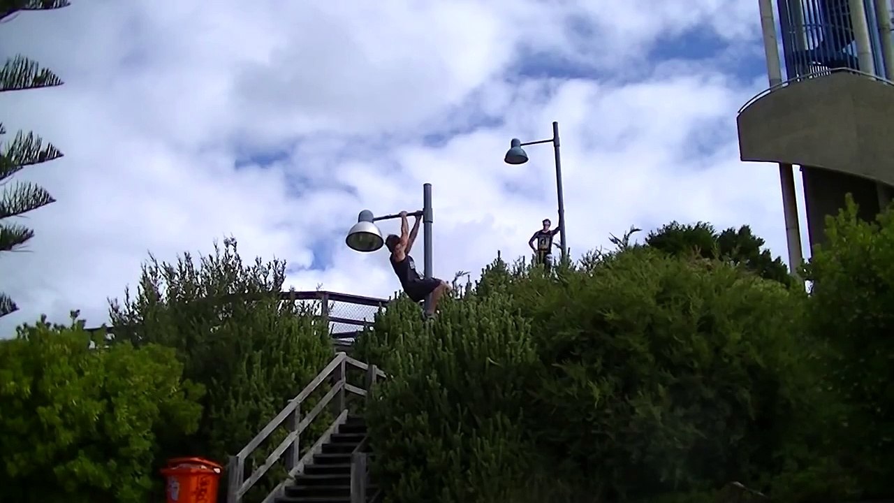 Extreme chin ups in park
