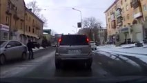 Dude slips on ice, almost gets run over by a car, and then he acts like he meant to do that.