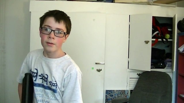 Kid shoots screen with airsoft gun