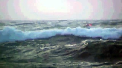 Asta B fishing boat coming in to harbour in heavy sea. Grindavik Iceland.