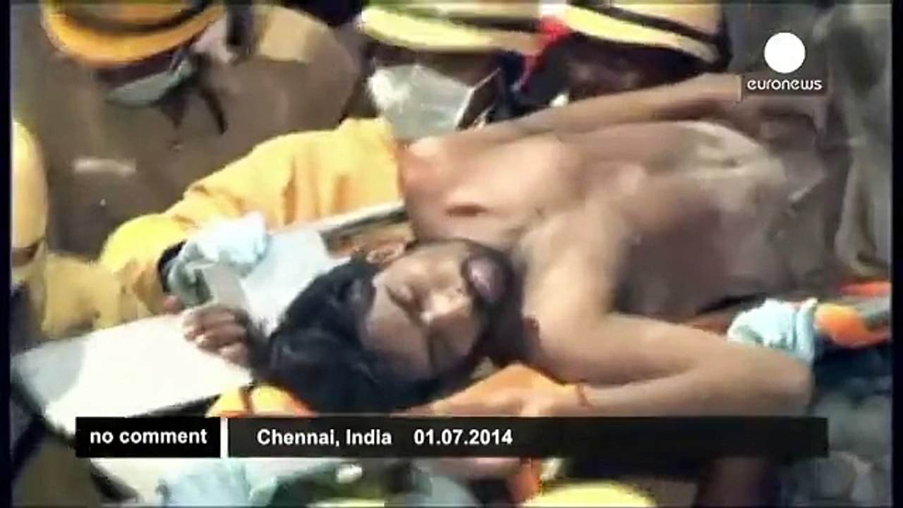 India - Rescue workers pull out survivors from collapsed building - no comment