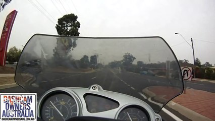 Car pulls across Motorcycle rider causing crash.