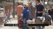 Syrian residents of Homs return to salvage what remains after rebels evacuate - no comment