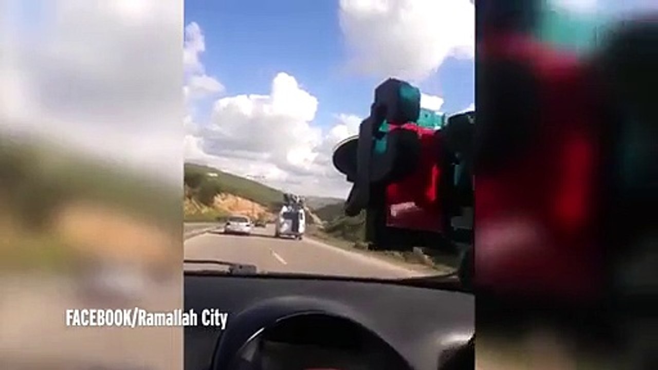 Watch as van carrying passengers on its roof swerves out of control - sending them flying