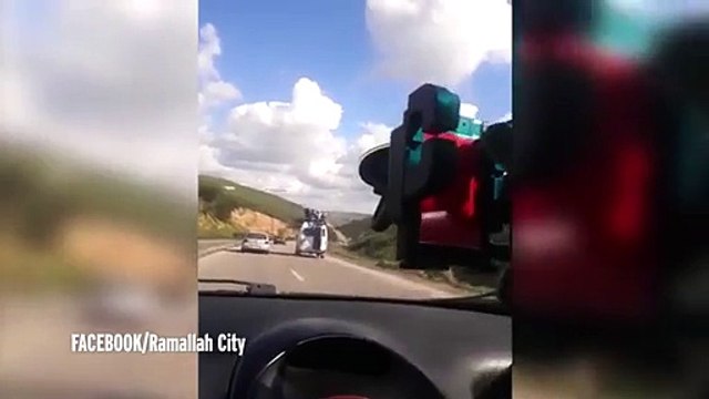 Watch as van carrying passengers on its roof swerves out of control - sending them flying