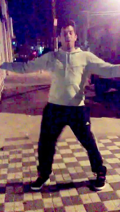 Argentinian guy happily dances to the sound of a car alarm