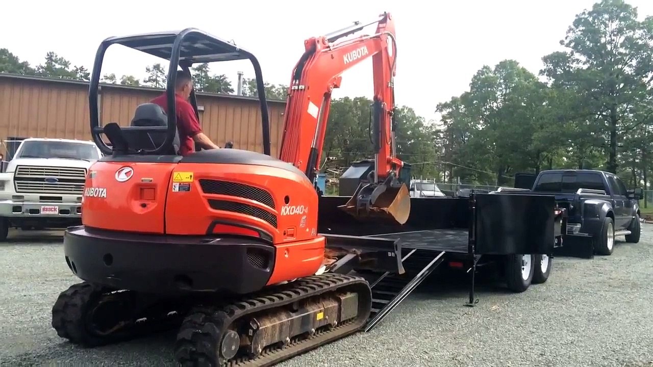Loading a Excavator in a PJ 83" Low-Pro Dump Trailer