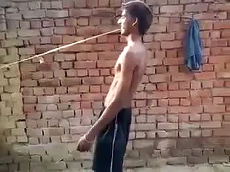 A Boy Pulls Tractor with his Teeth