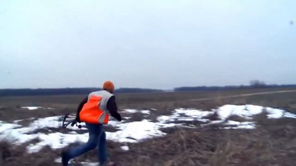 A hunter throws his bow on a pheasant