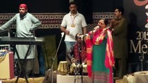 A lady singer perform singing song  on the stage Lok Virsa festvil at Islamabad PCCNN by chaudhry Ilyas sikandar