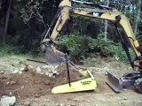 Excavator Hopper demo using caterpiller mini excavator (US Patent 7,473,068)