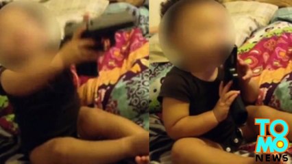 أسوأ والدان في العالم يصوران طفلهما الرضيع يلعب بمسدس حقيقي