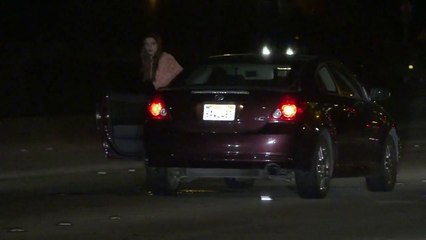 Drunken woman stops her car in the middle of highway
